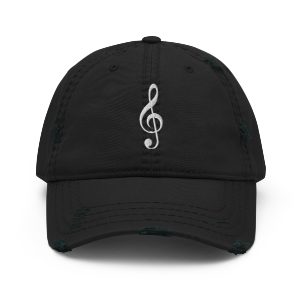 A vintage-style distressed dad hat featuring a white embroidered Treble Clef musical symbol.