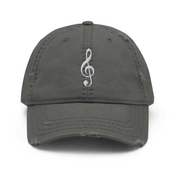 A vintage-style distressed dad hat featuring a white embroidered Treble Clef musical symbol.