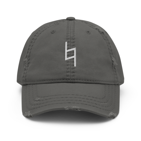 A distressed black dad hat with a white embroidered Natural Sign musical symbol on the front.