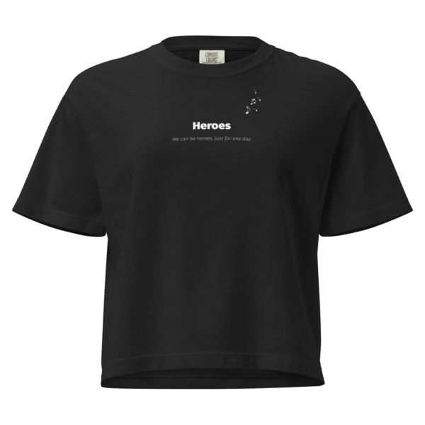 Woman wearing the Heroes heavyweight boxy tee in a vintage wash with bold minimalist typography.